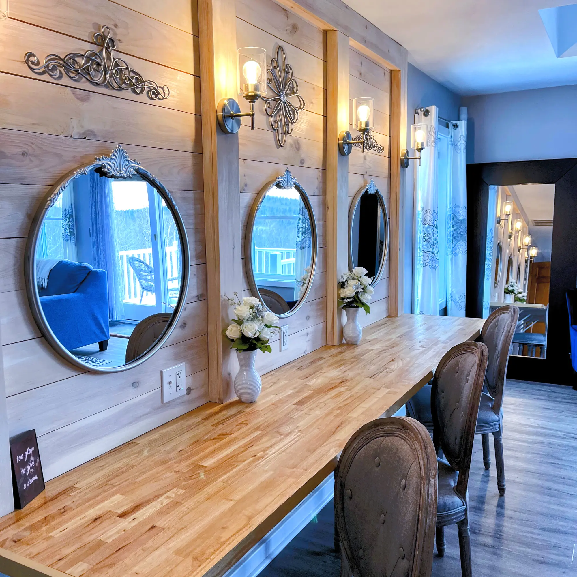 The renovated bridal suite with vanity stations and round mirrors