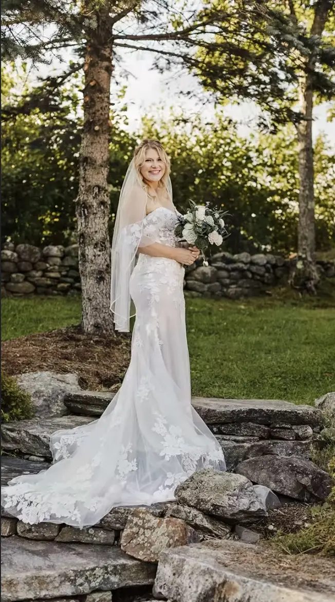 Bridal portrait on the stone ledges at the edge of the property