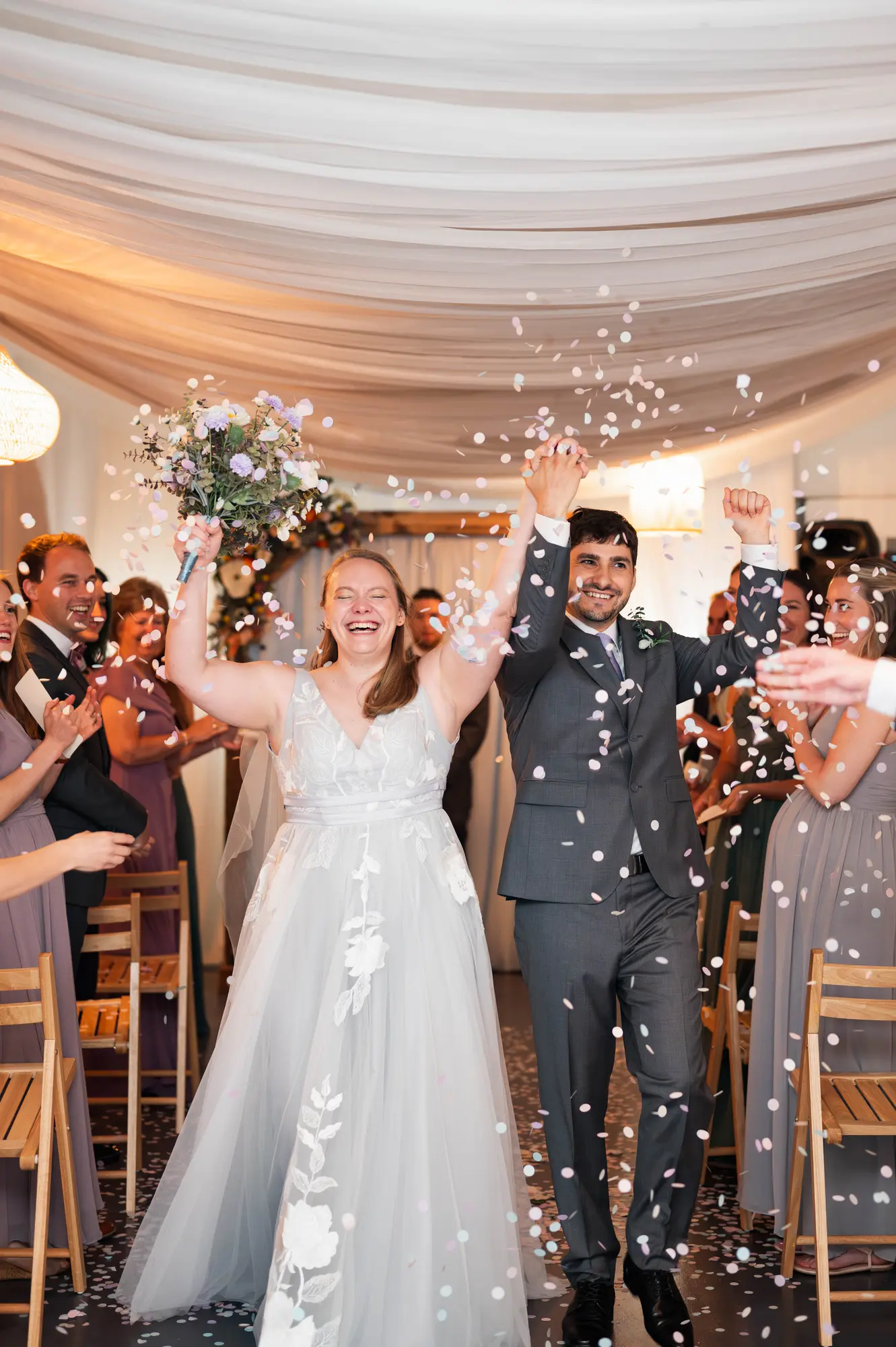 Confetti send-off as the newlyweds exit the reception