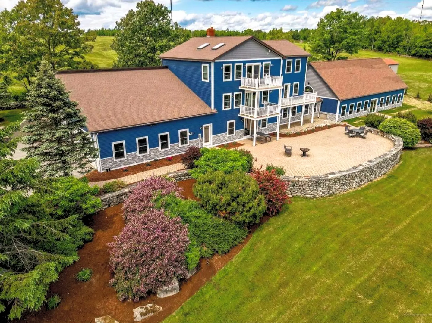 Aerial view of the Luxe Liberty estate and grounds on Liberty Hill, Maine