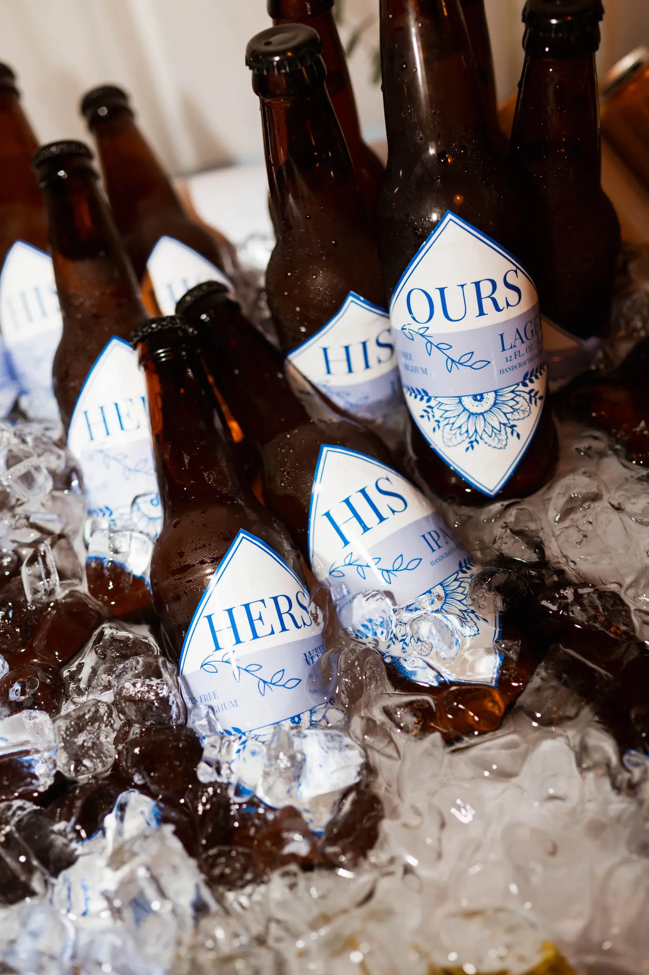 His, hers and ours bottles chilling on ice at the reception