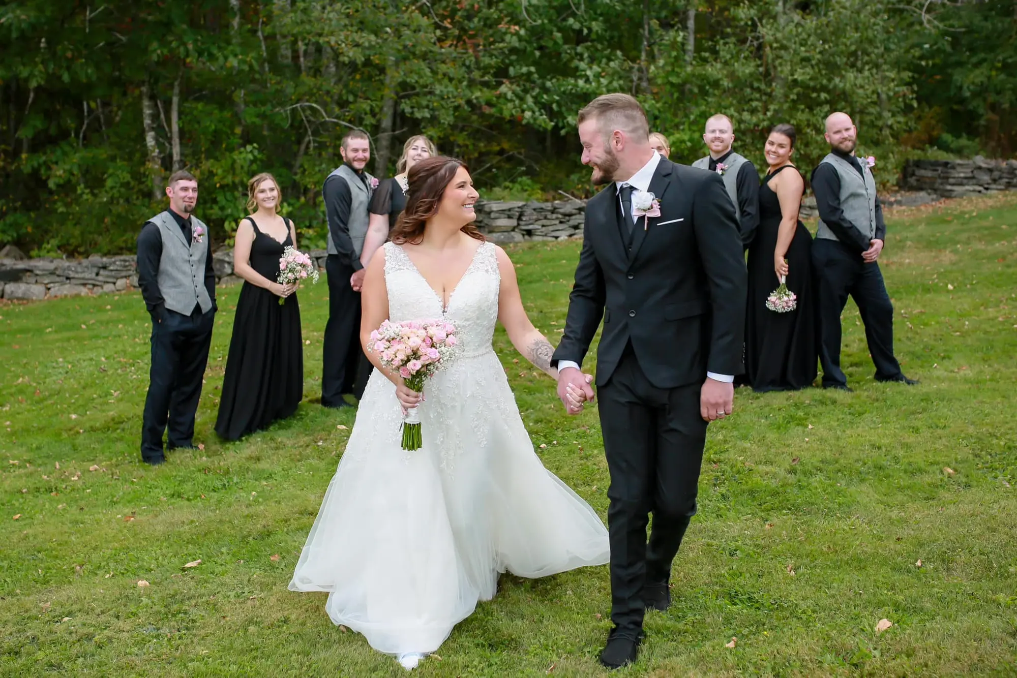 Wedding party walking across the lawn at Luxe Liberty